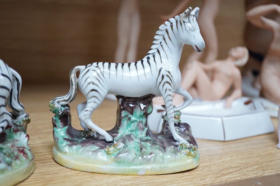 A pair of mid 19th century Staffordshire pottery models of Zebra, 12.5cm high